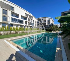 DİDİM DE HAVUZLU LÜKS SİTE İÇİNDE 2+1 BAHÇE KULLANIMLI DAİRE