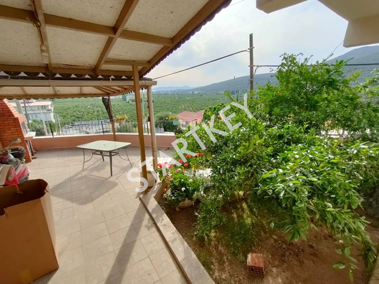 Startkey Gümüldür merkezde deniz manzaralı geniş bahçeli müstakil ev