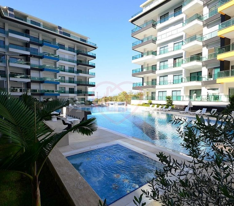 For Sale: Furnished 1+1 Apartment with Pool View, 100m from the Sea – Konak Seaside Resort,