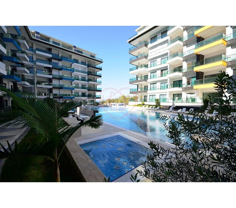 For Sale: Furnished 1+1 Apartment with Pool View, 100m from the Sea – Konak Seaside Resort,