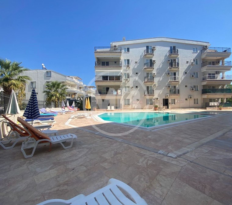 DİDİM DENİZE YAKIN SİTE İÇİNDE GENİŞ BALKONLU EŞYALI 2+1 DAİRE