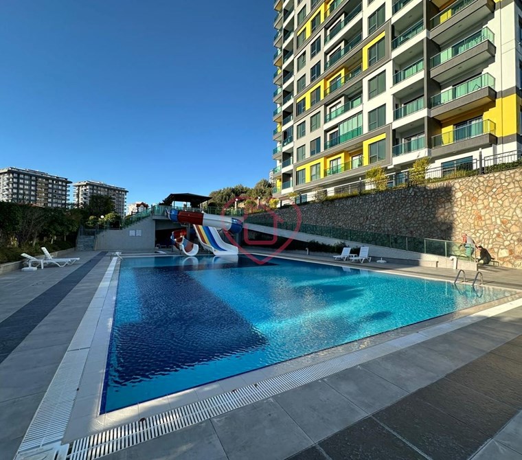 Furnished 1+1 apartment for sale. Panoramic mountain and nature views. Konak Garden Life