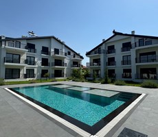  Fethiye Babataş’ta Site İçinde, Sahile Yürüme Mesafesinde 2+1 Modern Bahçe Katı Daire