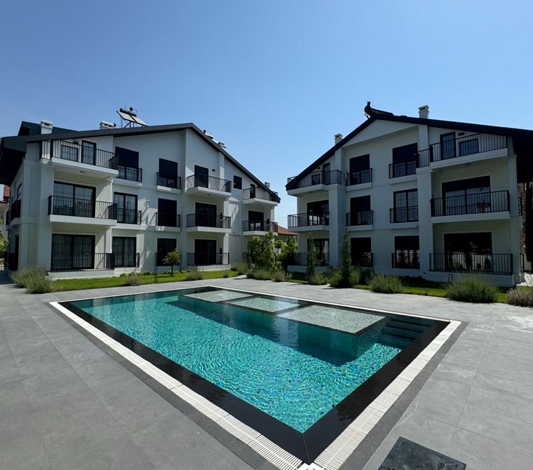  Fethiye Babataş’ta Site İçinde, Sahile Yürüme Mesafesinde 2+1 Modern Bahçe Katı Daire