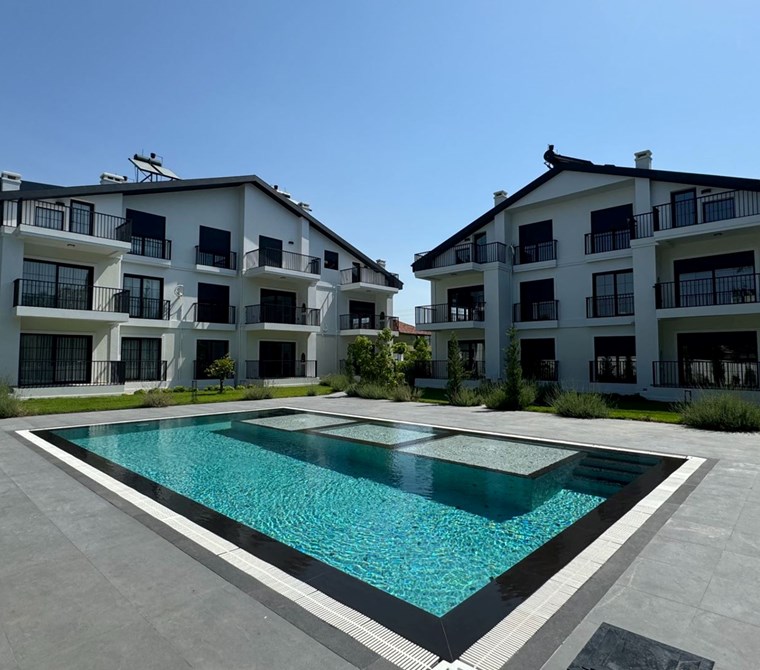  Fethiye Babataş’ta Site İçinde, Sahile Yürüme Mesafesinde 2+1 Modern Bahçe Katı Daire