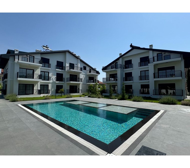  Fethiye Babataş’ta Site İçinde, Sahile Yürüme Mesafesinde 2+1 Modern Bahçe Katı Daire