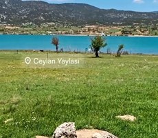 Muğla Seydikemer Yayla Ceylan’da 951 m² Hisseli Tarla –Göl Manzaralı